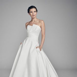 Suzanne Neville Amethyst Wedding Dress - Structured strapless A Line dress with wrap detail on bodice, a gorgeous sweeping train and chic pockets.