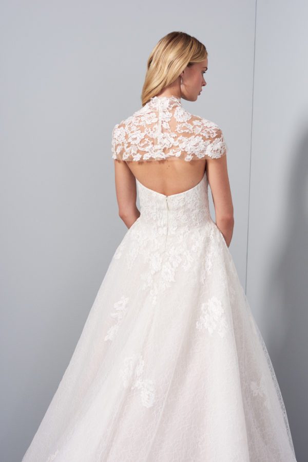 Allison Webb Sutton Wedding Dress - A-line gown with Ivory French lace layered over Cashmere lining, appliques on the skirt, molded bodice and chapel train.