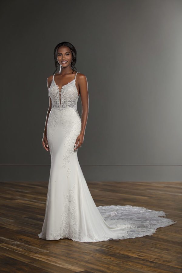 Martina Liana 1165 wedding dress - A beautiful fit and flare dress with delicate 3D floral features and a sheer bodice, deep plunging neckline, and train.