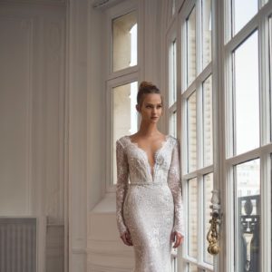 Netta BenShabu Polly Wedding Dress - Fit and flare style dress with long sleeves, deep plunging neckline, and a open low back with elegant triangle train.