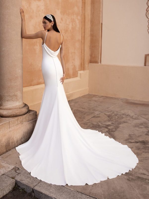 Pronovias Antiope Wedding Dress - Crepe minimalist fit and flare gown with thin straps, a fitted waist and loose cowl draping down the back.