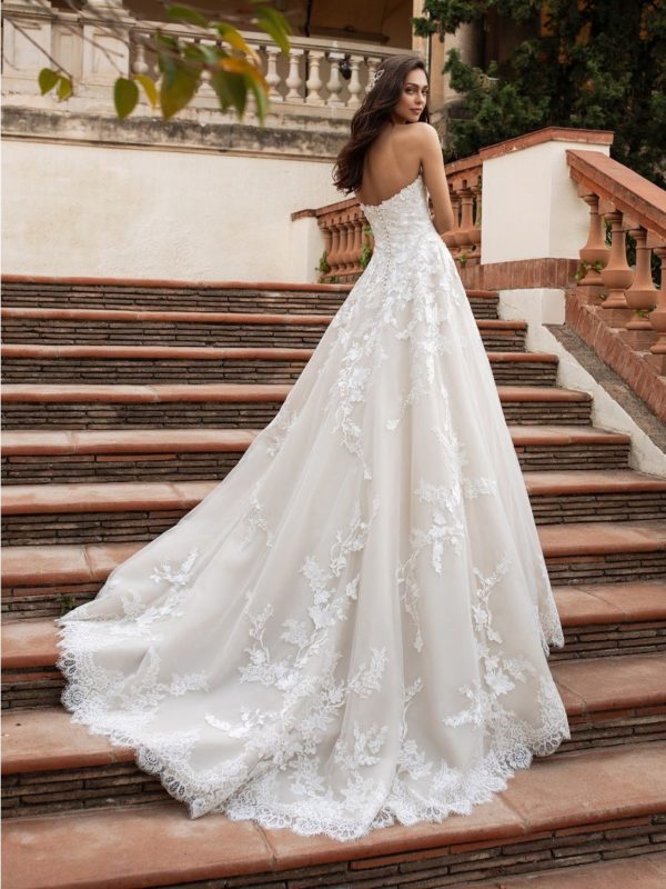 Pronovias Elcira Wedding Dress - This cream, strapless, sweetheart neckline, off-the-shoulder dress, crafted in soft tulle and layers of lace petals.