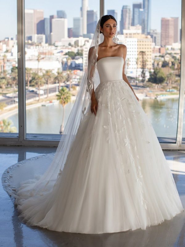 Pronovias Grayson Wedding Dress Sample Sale - A Line with layers of floating chiffon on skirt, strapless neckline, embroidered appliqués and fitted bodice.