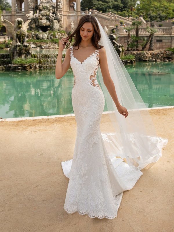 Pronovias Morocco Wedding Dress Sample Sale - Mermaid silhouette dress with illusion paneling, embroidery over lace, v-neckline, low open back and train.