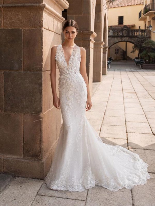 Pronovias Aethra Wedding Dress - Mermaid gown with 3D flowers along the deep v-neckline that gather at the waist and cascade down the skirt.