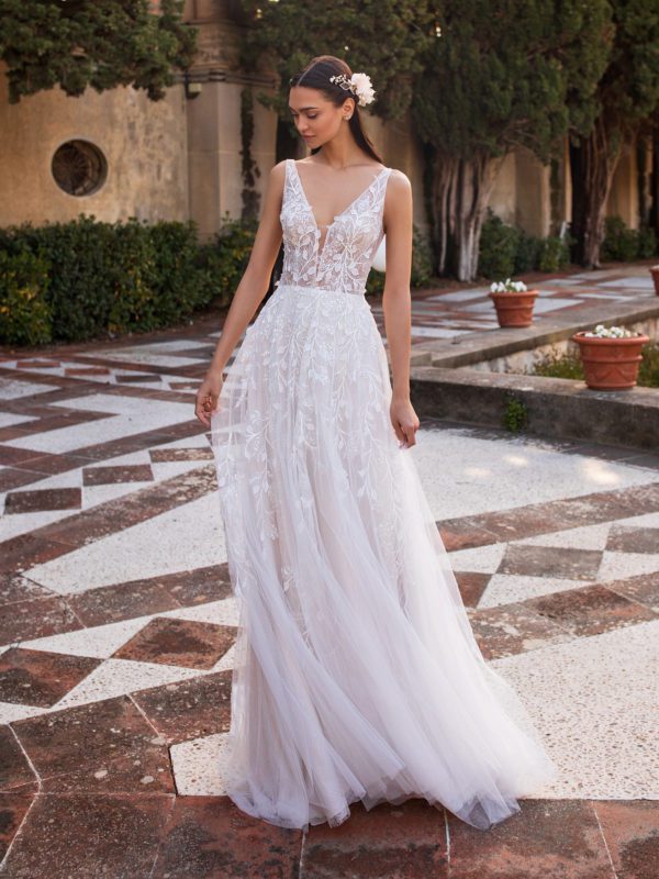 Pronovias Elara Wedding Dress - Thin vines with floating leaves trace the straps, V-neckline, illusion bodice, and tulle skirt of this sheath gown.