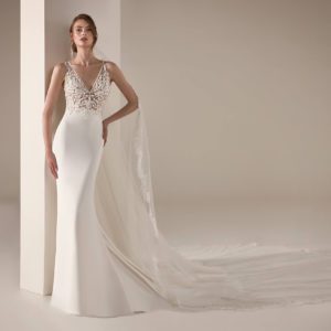 Pronovias Yari Wedding Dress - Mermaid style with illusion bodice, deep v neckline, embroidered roses on bodice, and crepe skirt. Two piece illusion