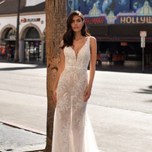 Pronovias Mansfield Wedding Dress Sample Sale - Sheath dress with tulle and semi-transparent lace featuring a plunge v-neckline and open back.