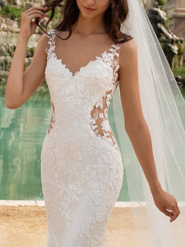 Pronovias Morocco Wedding Dress Sample Sale - Mermaid silhouette dress with illusion paneling, embroidery over lace, v-neckline, low open back and train.