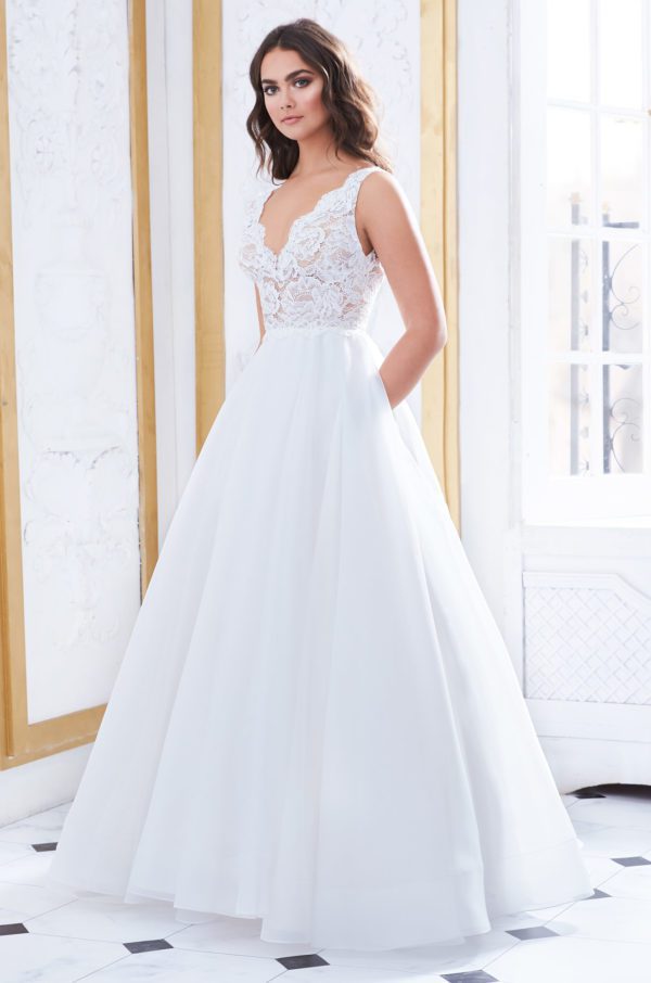 Paloma Blanca 4852 Wedding Dress - Ball gown silhouette with lace bodice, deep V-neckline in Nude Italian Tulle along neckline and waist and low open back.