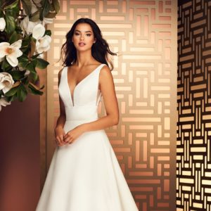 Paloma Blanca 4892 Wedding Dress -Satin faille A-line dress with deep V-shaped neckline, Italian Tulle inserts at side seams, pockets and covered buttons.
