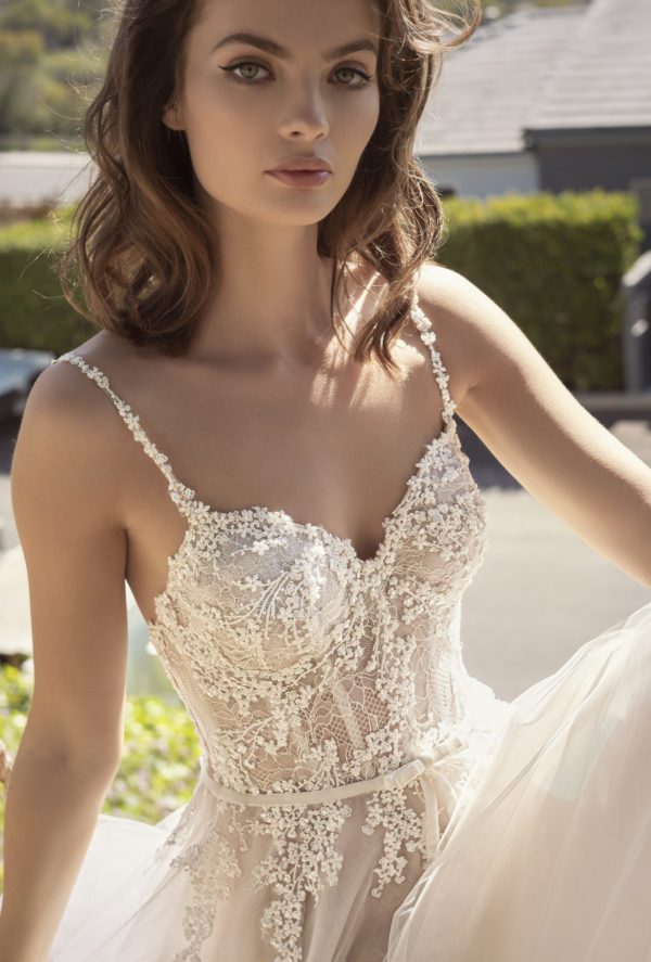 Netta BenShabu Beth Wedding Dress - A Line style dress with spaghetti straps, boning bodice, delicate floral embroidery cascading, and sweetheart neckline.