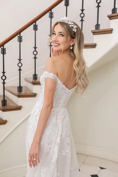 Estee Couture Kiki Wedding Dress - A Line style with a modified sweetheart neckline, Off the shoulder straps, detachable long sleeves and Train.