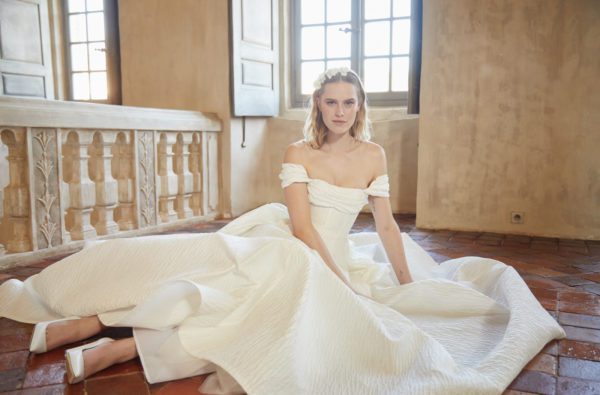 Peter Langner Novara Wedding Dress - Ballgown dress in jacquard with an off the shoulder neckline, fitted bodice, draped bust detail and train.