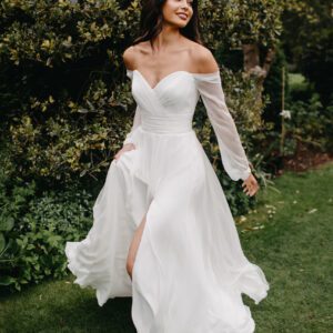 Suzanne Neville Molly Wedding Dress - Gorgeous A-line gown with a front slit, sweetheart neckline and off the shoulder long sleeves.