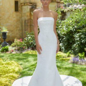 Allison Webb Essex Wedding Dress - Fit and flare gown with delicate beaded embroidery, cuff neckline, and a detachable bow.