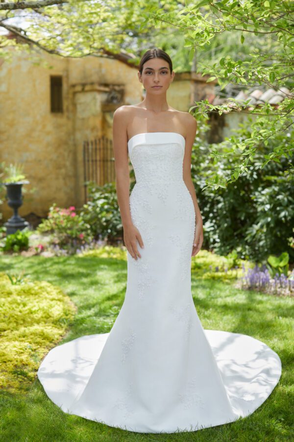 Allison Webb Essex Wedding Dress - Fit and flare gown with delicate beaded embroidery, cuff neckline, and a detachable bow.