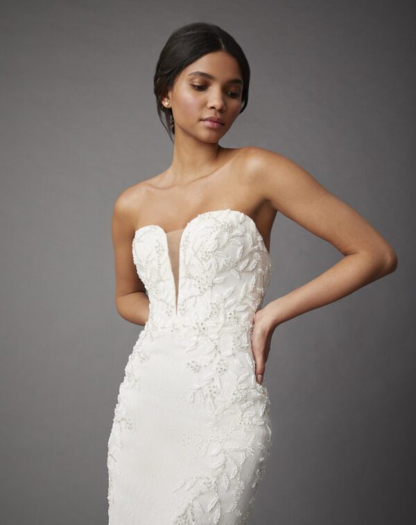 Allison Webb Hollis Wedding Dress - Candlelight Chantilly lace fit and flare gown with a plunging sweetheart strapless neckline and floral beading.