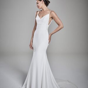Suzanne Neville Freya Wedding Dress - Fit and flare dress with thin straps, draped neckline, sequin bodice, train detail, deep cut sides and v- back. 