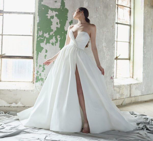 Lazaro Bacall 32206 Wedding Dress - Ballgown style dress with plunging deep v sweetheart neckline and ruched bodice with side slit and low back.