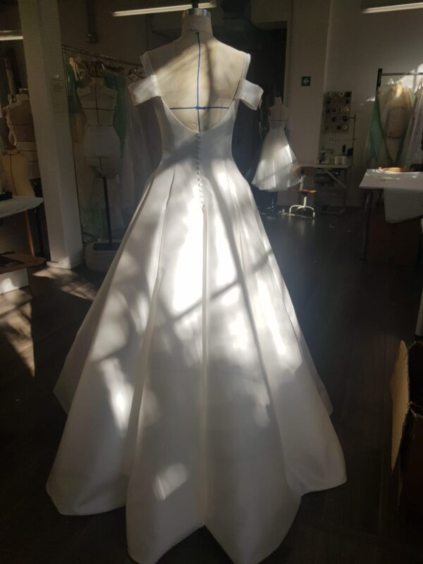 Peter Langner Riley Wedding Dress - Ballgown dress in Magnoila Mikado, square neckline, open back, pleats on skirt, and double straps.