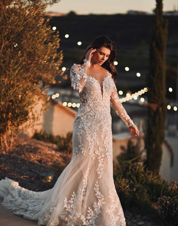 Martina Liana 1440 Wedding Dress — Sheath style dress with fitted lace long sleeves, deep plunge neckline, open back and 3d floral appliqué all over.