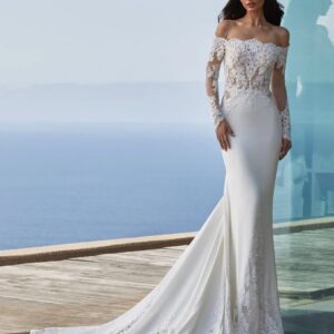 Pronovias Della Wedding Dress - Off the shoulder mermaid dress in crepe fabric with tattoo-effect long sleeves, fitted bodice & delicate scallop-edge train. 