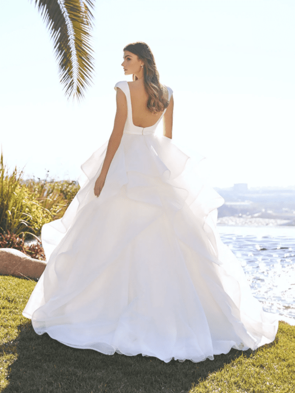 Pronovias Dominika Wedding Dress - A Line Layers of ruffles in organza, fitted bodice in mikado, deep sweetheart neckline, cap sleeves and scoop back. 