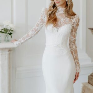 Suzanne Neville Manoir Wedding Dress - Fit and flare dress with illusion French lace high neckline, fitted bodice, sweetheart neckline and long sleeves