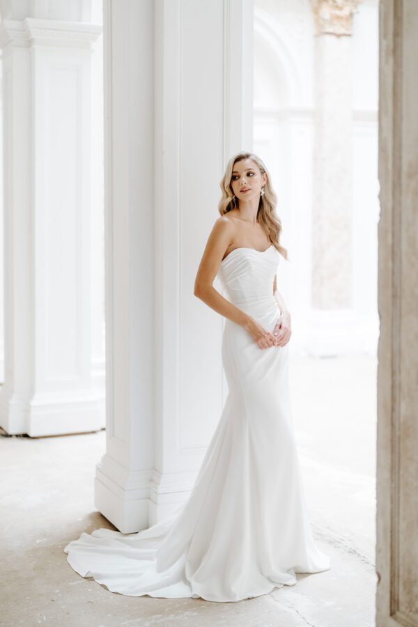 Suzanne neville Rosewood Wedding Dress - Fit to flare style dress with a fitted bodice, sweetheart neckline and draped detail with train. 