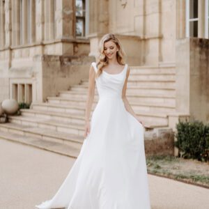 Suzanne Neville Lanesborough Wedding Dress - Flattering A Line silhouette, scoop neckline, fitted bodice, and draped detail, made of Italian crepe.