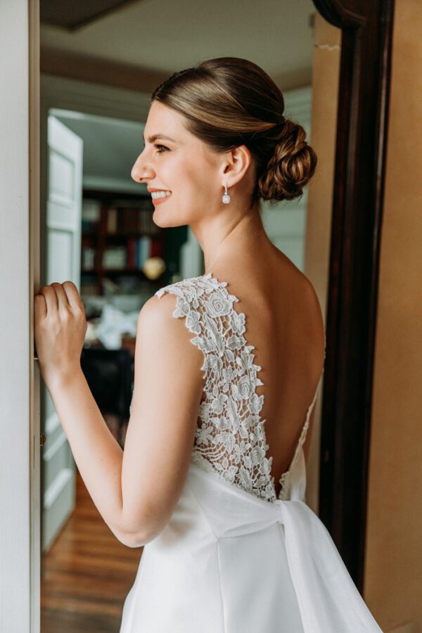 Peter Langner Audrey Wedding Dress - A line in silk magnolia with high neck, open v-back, sash detail, 3D Floral appliqué, guipure lace straps and a train.