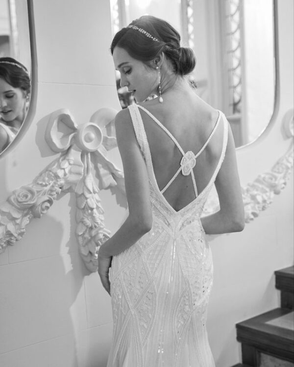 Rosa Clara Collection Quiric Wedding Dress - Modern dress with straight silhouette, plunging neckline, straps and open back. Criss-cross back and rhinestones. 