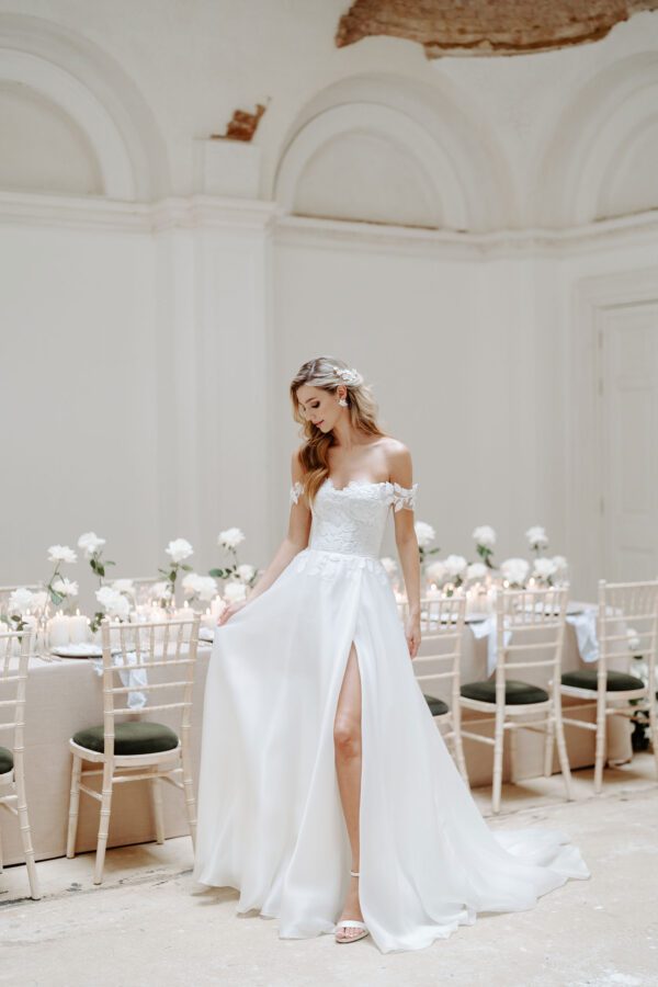 Suzanne Neville Thalasso Wedding Dress - Delicate A Line dress with a layer of hand cut floral 3D appliqué, a sweetheart neckline and a silk organza train.
