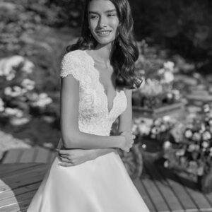 Rosa Clara Couture Cabor Wedding Dress - Princess cut dress with organza skirt, plunging neckline, dropped sleeves, illusion fabric, lace and v-neckline.