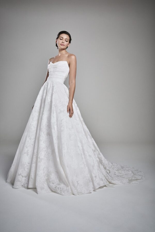 Suzanne Neville Paige Wedding Dress - Ball gown style dress with a sweetheart neckline, fitted draped bodice and small train. 
