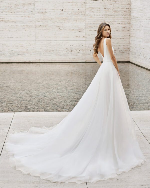 Rosa Clara Collection Nagash Wedding Dress - Crepe fabric, plunging neckline and open back, shoulder straps, side slit in skirt and detachable train.