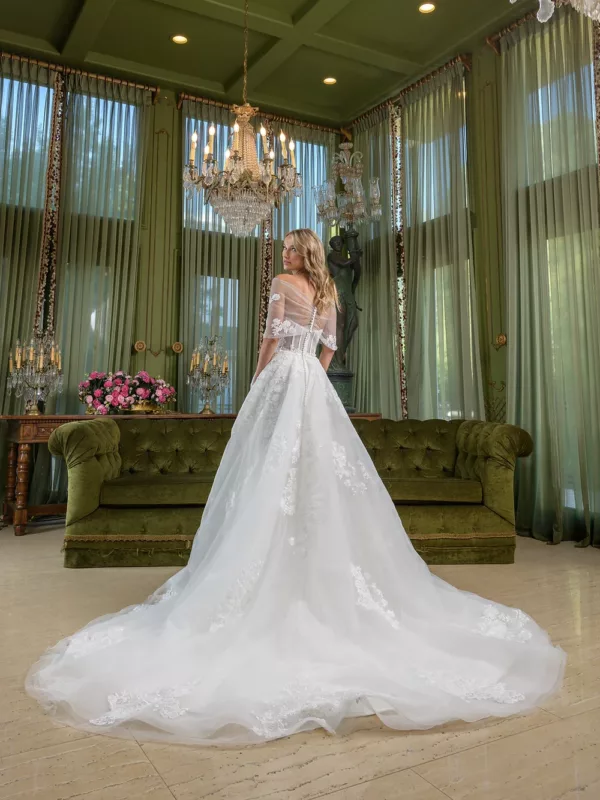Estee Couture Dekota Wedding Dress - A Line with slim bodice, side pockets, off the shoulder details. sheered back with lace buttons and Cathedral train.
