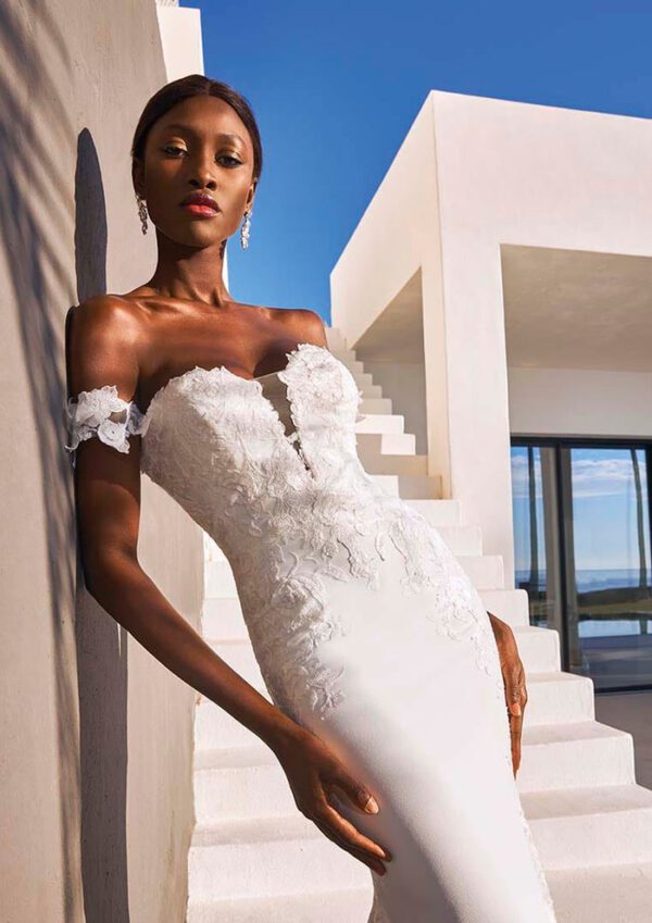 Pronovias Octavia Wedding Dress - Mermaid style, sustainably made crepe, see-through neck and backline, corset-style, 3D flowers on the dropped sleeves.