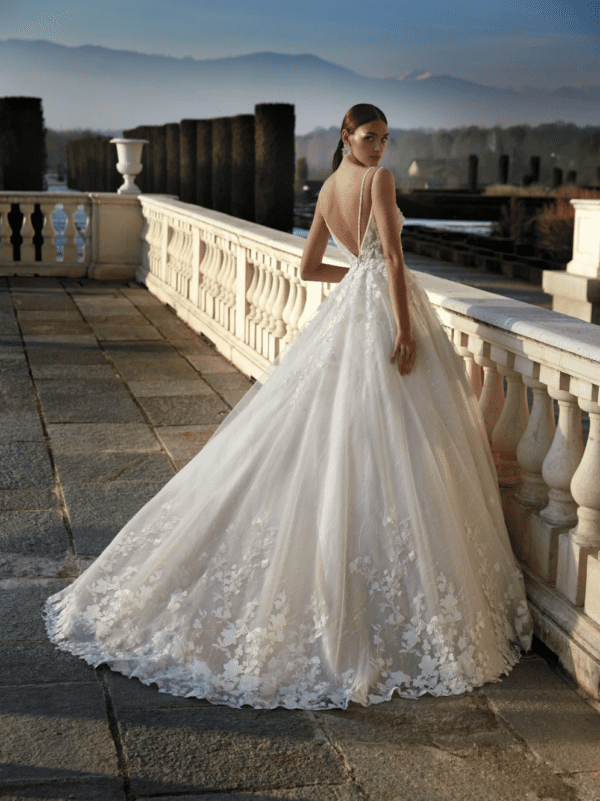 Pronovias Delaney Wedding Dress - Hand-worked lace appliqué, flowers effect, deep neckline, side cutaways and plunge back finished with beaded straps.