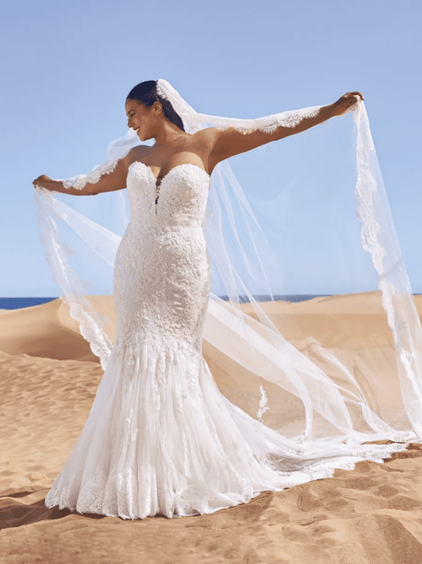 Pronovias Ermin Wedding Dress - Fit and Flare sweetheart bodice with sparkling beaded embroidery, floral motifs trace semi-transparent, tulle mermaid skirt.