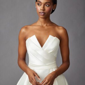 Allison Webb Parker Wedding Dress - Dupioni trumpet dress with architectural, origami-pleated bodice, natural waist and chapel length train.