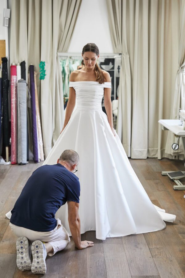 Peter Langner Makari Wedding Dress - Classic dropped waist ballgown dress with rouched bodice and off the shoulder straps detail.