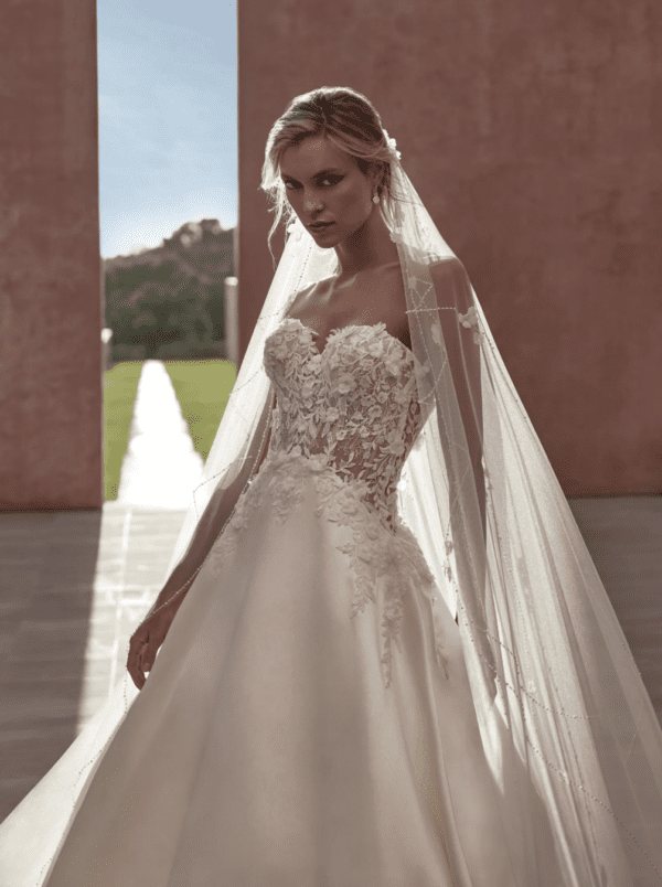 Pronovias Floridia Wedding Dress - A Line skirt in silken mikado with sweetheart neckline and crafted bodice dappled with floral lace appliqués.