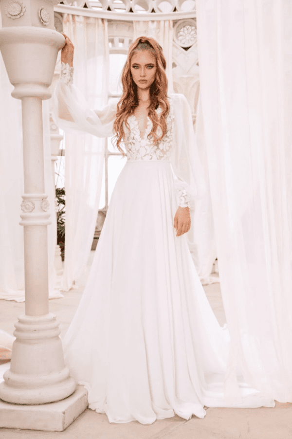 Dany Tabet Martina Wedding Dress - Long Sleeves, V-Neckline, A-Line, Floral Lace bodice and cuff details.