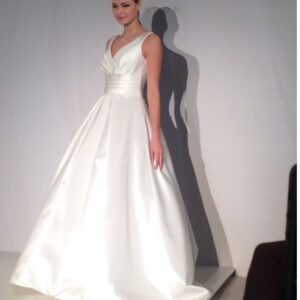 Suzanne Neville Novello Wedding Dress - Ball gown with deep V - Neckline, low back, shoulder straps and waist band.