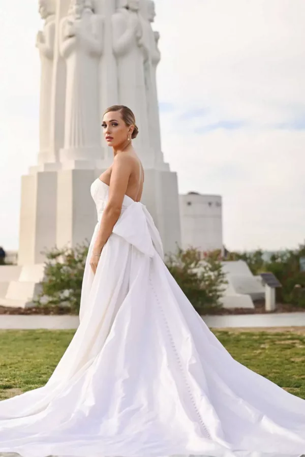 Martina Liana 1524 Wedding Dress - A Line silhouette with sweetheart neckline, wrapped fit bodice, slit, hidden hand pockets, oversized bow back and train. 