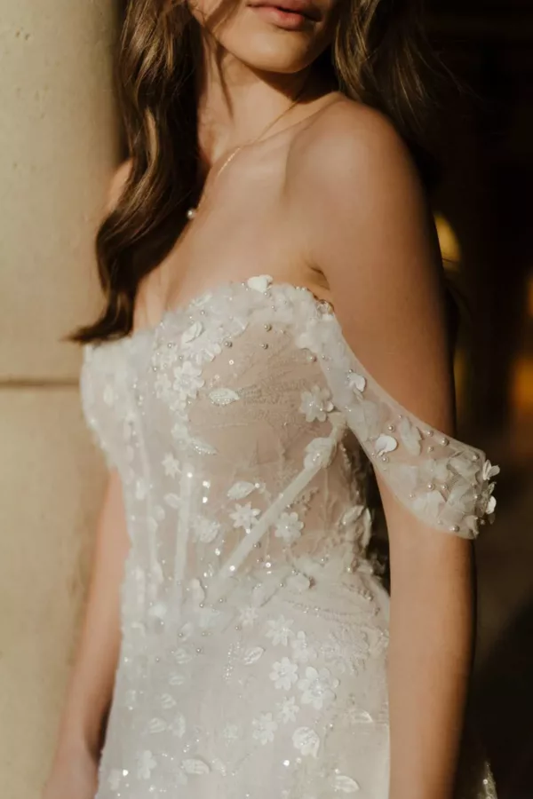 Martina Liana 1598 Wedding Dress - A Line with allover 3D florals lace and pearls, detachable embellished off the shoulder straps, and sweetheart neckline. 