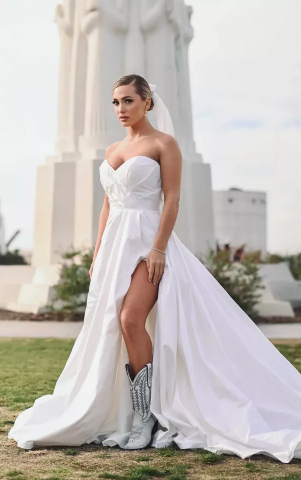 Martina Liana 1524 Wedding Dress - A Line silhouette with sweetheart neckline, wrapped fit bodice, slit, hidden hand pockets, oversized bow back and train. 