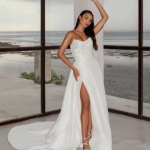 Tulle NY MP Satin Wedding Dress - Light Silk Satin strapless gown with a cat eye neckline, bias placed tucks, and a pleated skirt opening to a deep slit.